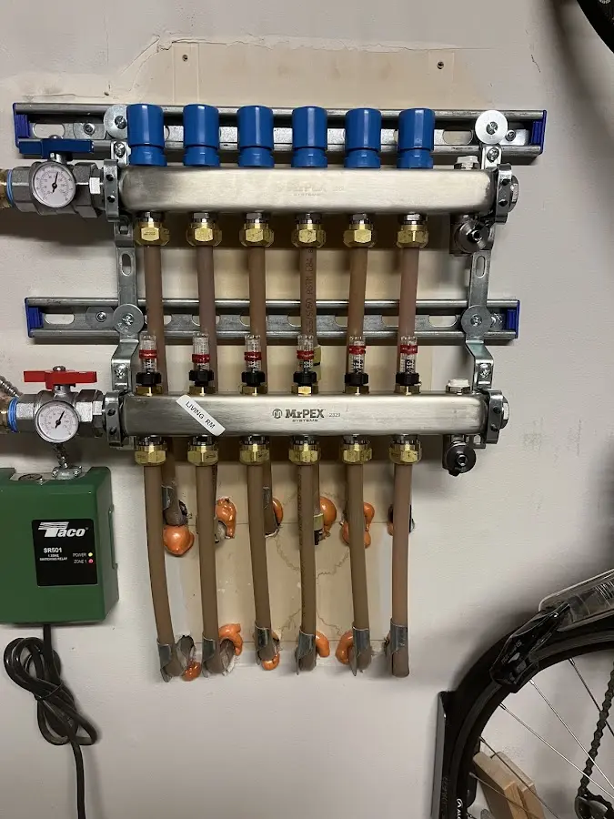 Plumber performing Water Heater Repair at a residential property in Price